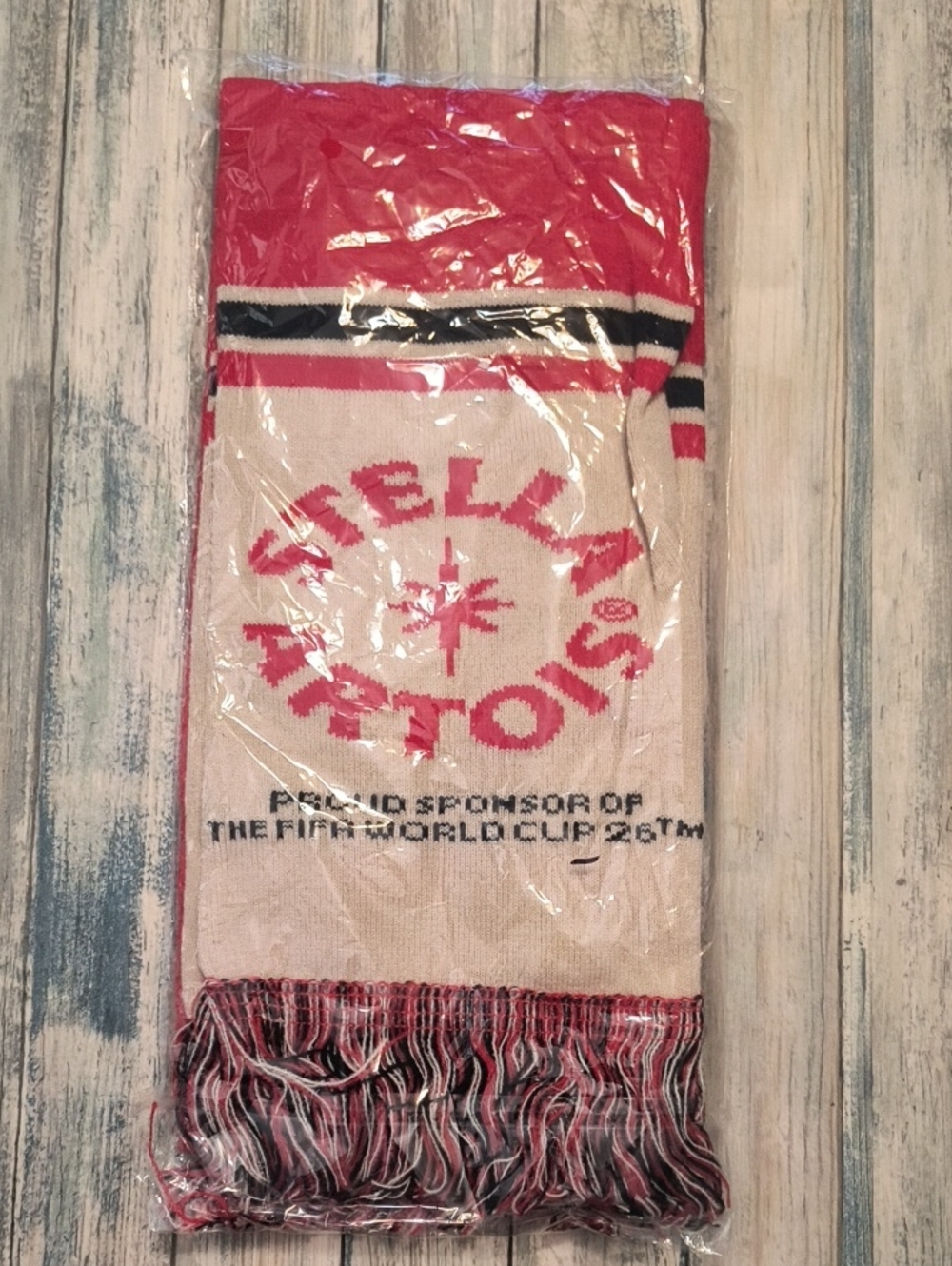 Stella Artois scarf is a promotional item for the 2026 FIFA World Cup